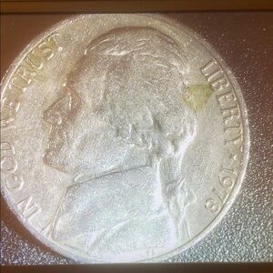 Silver Coin with Intricate Relief Design